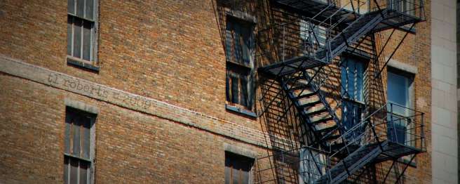 fire escape on brown brick building